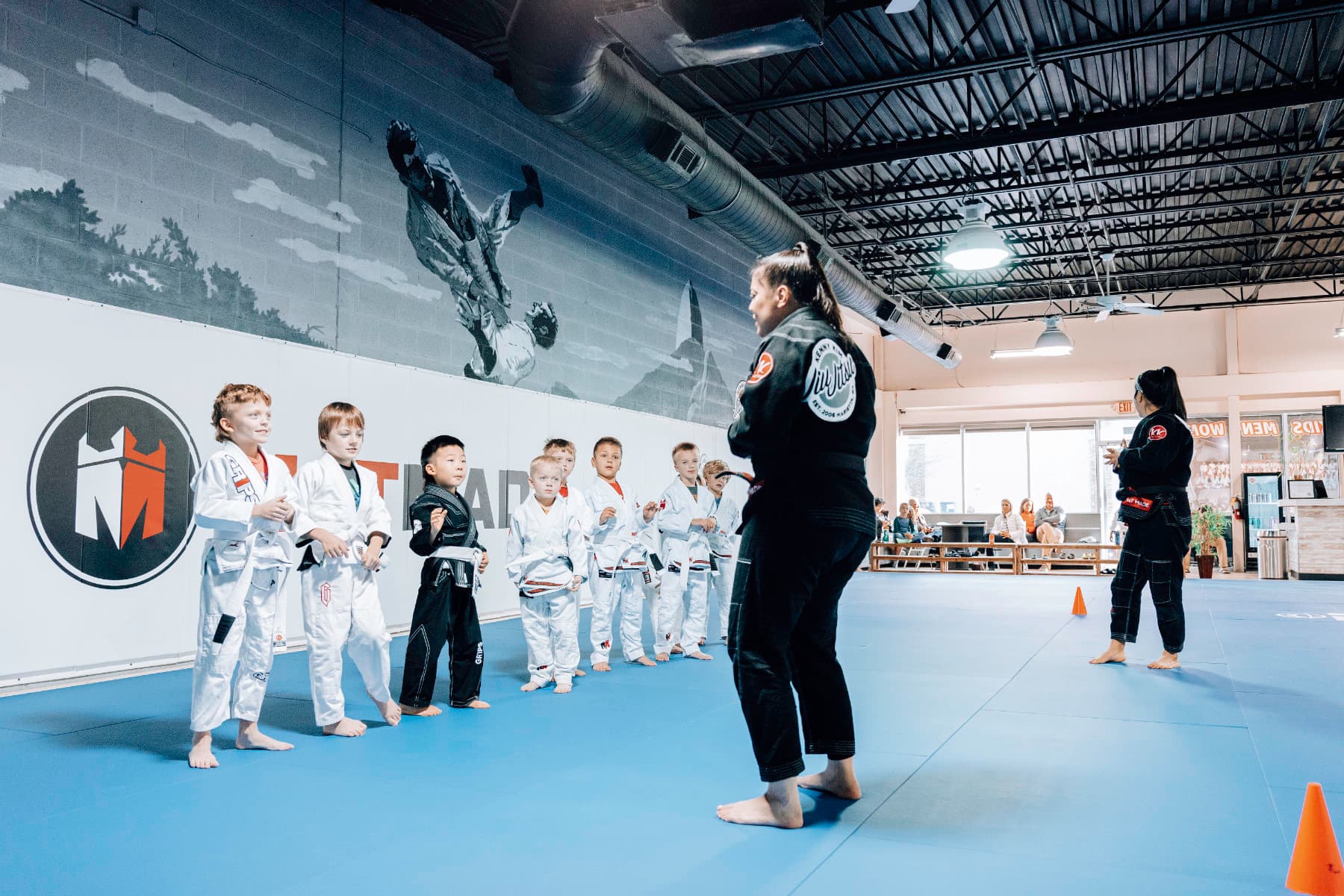 Brazilian Jiu Jitsu Kids at Kenny Kim BJJ in Marietta GA lined up infront of their instructor awaiting class