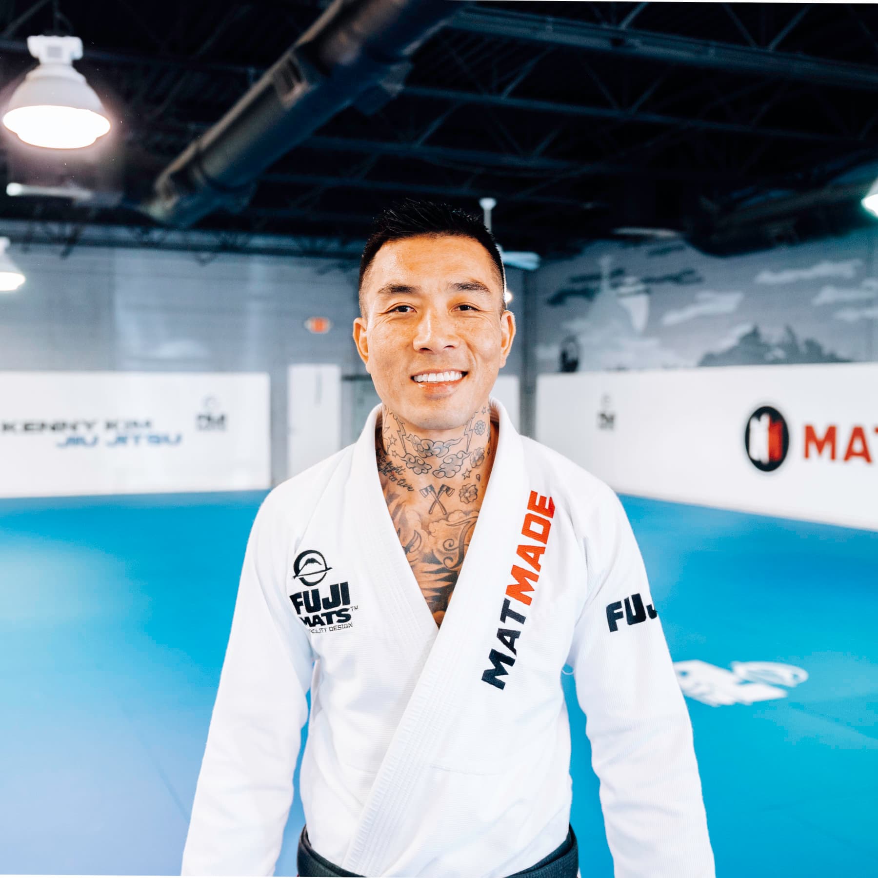 Kenny Kim smiling on the mats at Kenny Kim BJJ in Marietta GA