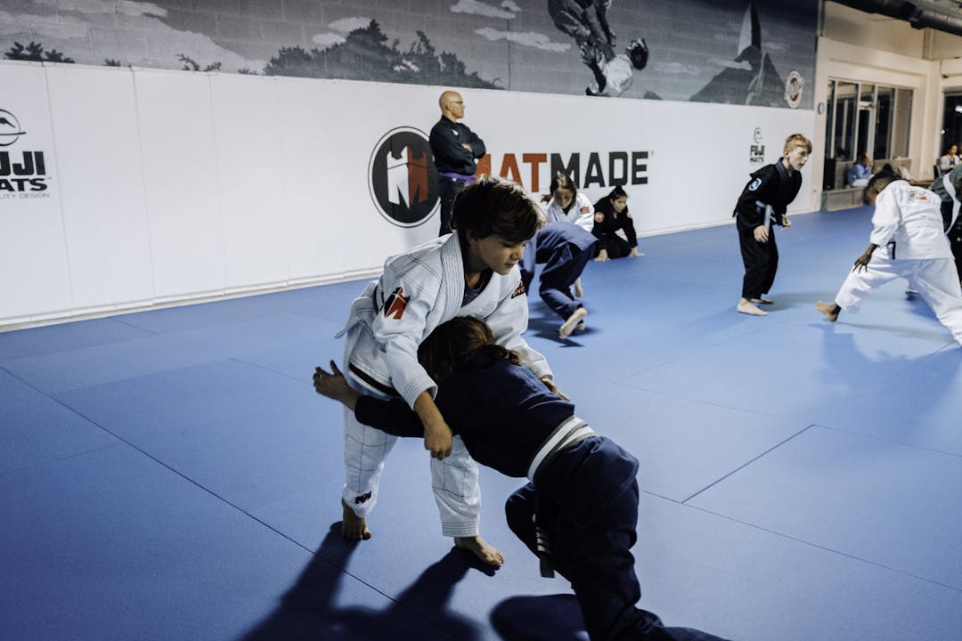 Brazilian Jiu Jitsu Kids at Kenny Kim BJJ in Marietta GA sparring and grappling in class
