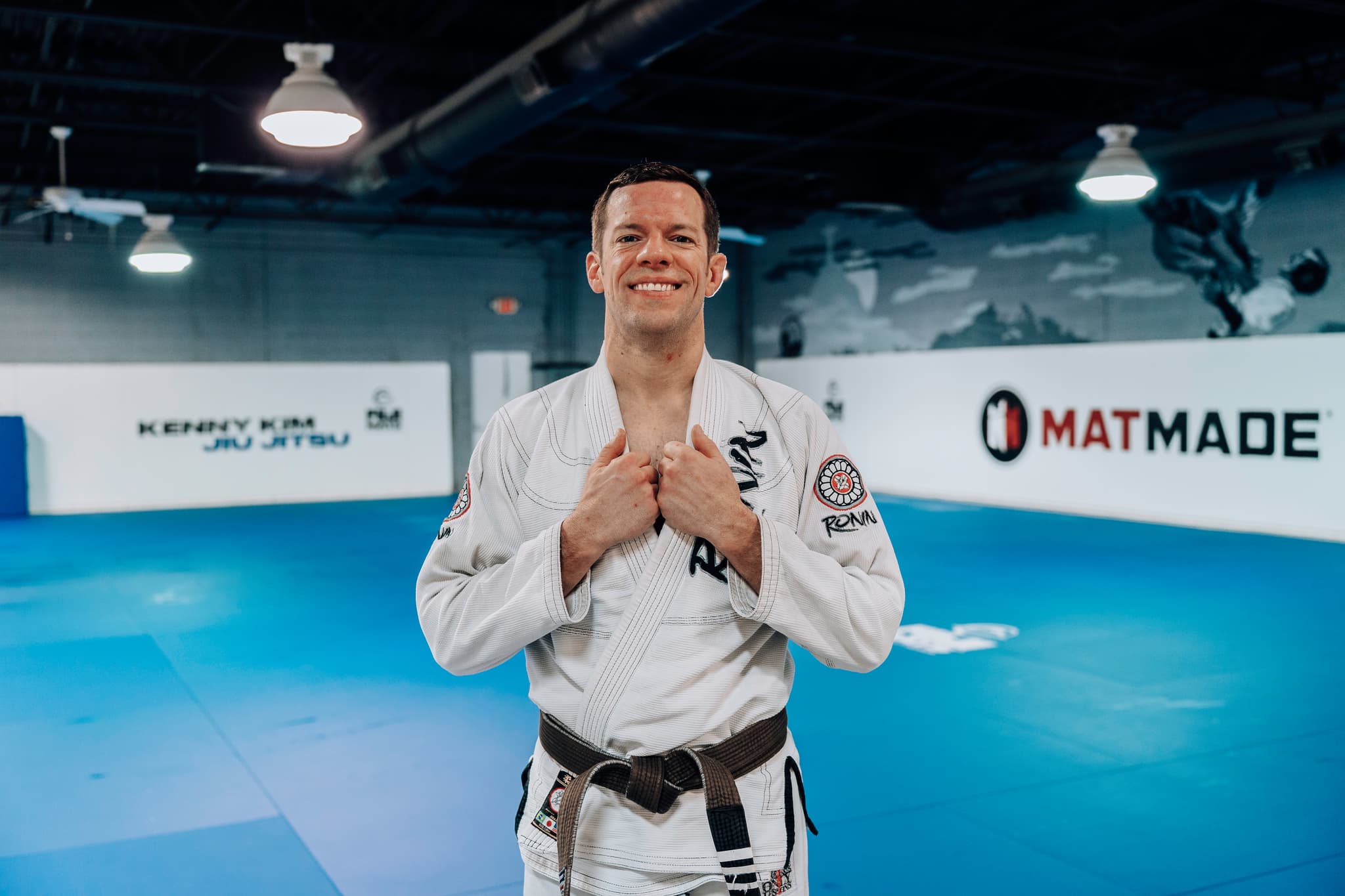Charles Pinkham standing on the mats at Kenny Kim Brazilian Jiu Jitsu in Marietta GA