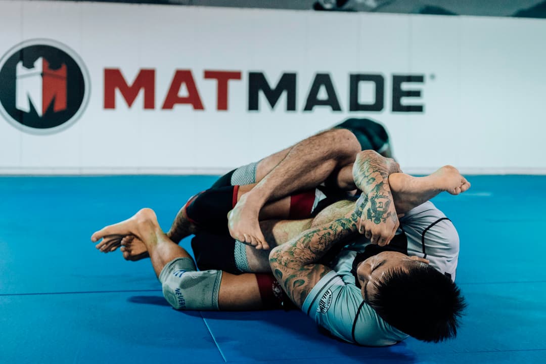 Brazilian Jiu Jitsu Students at Kenny Kim BJJ in Marietta GA rolling on the mats with Kenny Kim